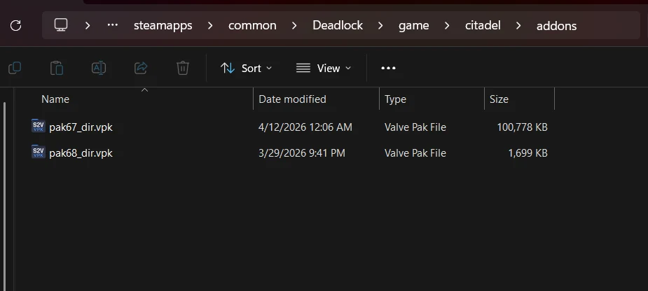 Two mods installed in the addons folder, named pak67_dir.vpk and pak68_dir.vpk